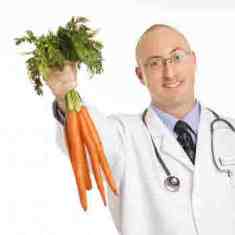 Scientist holding carrots which are not sugar